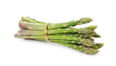 Photo of Many fresh green asparagus stems isolated on white