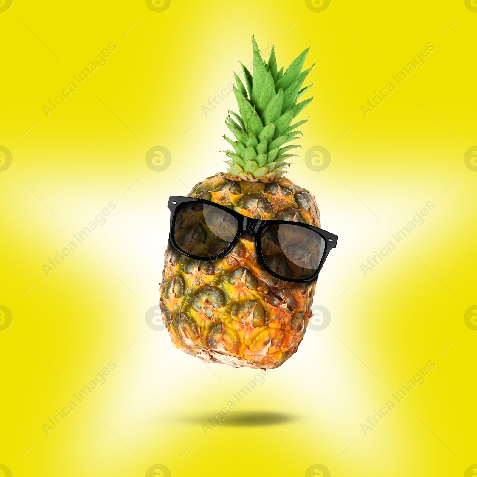 Image of Summer vibe. Pineapple with sunglasses on yellow background. Party flyer or other seasonal