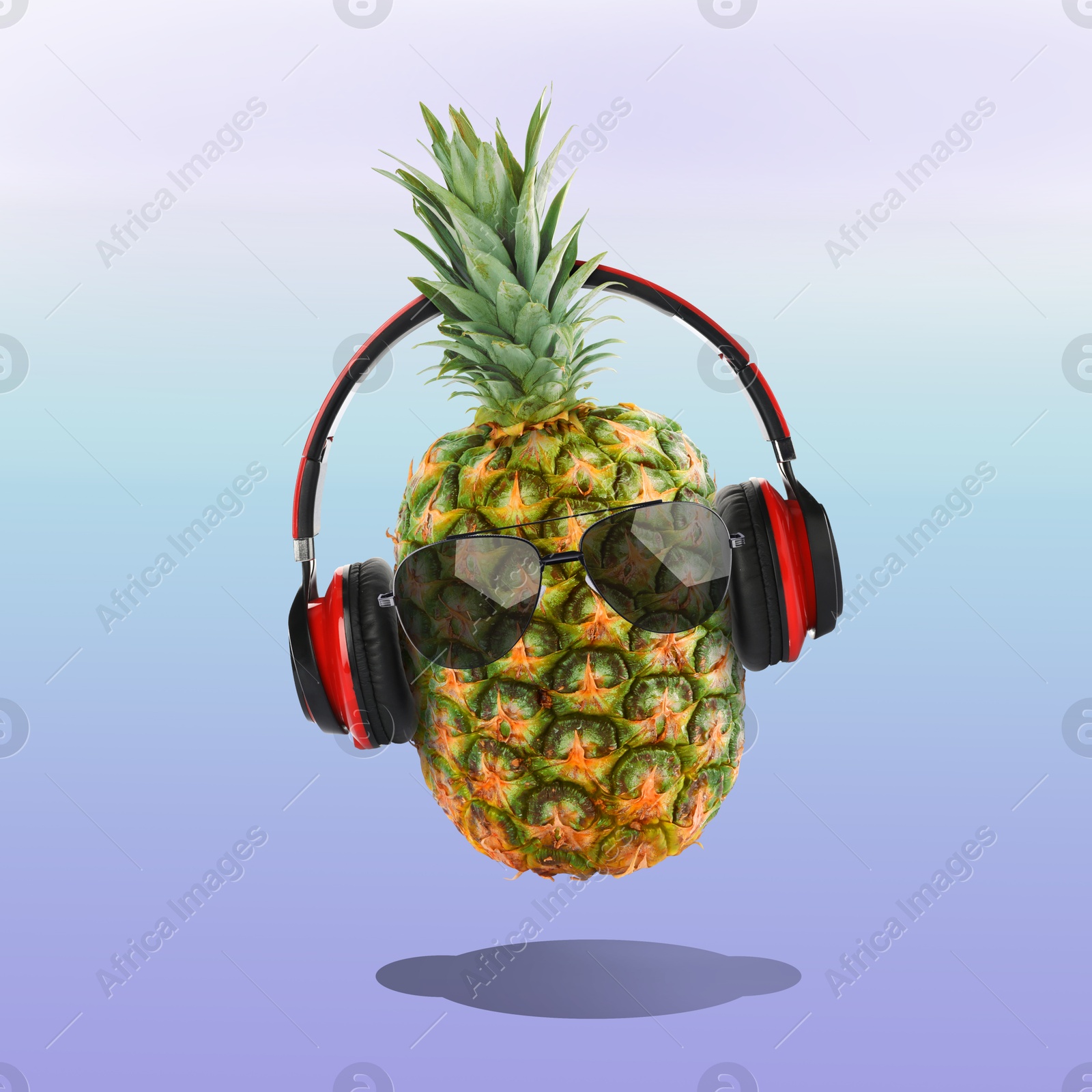 Image of Summer vibe. Pineapple with sunglasses and headphones on color gradient background. Party flyer or other seasonal