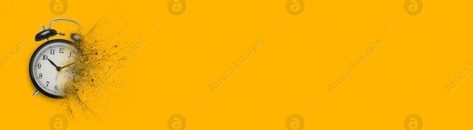 Image of Black alarm clock dissolving on orange background, banner design with space for text. Flow of time