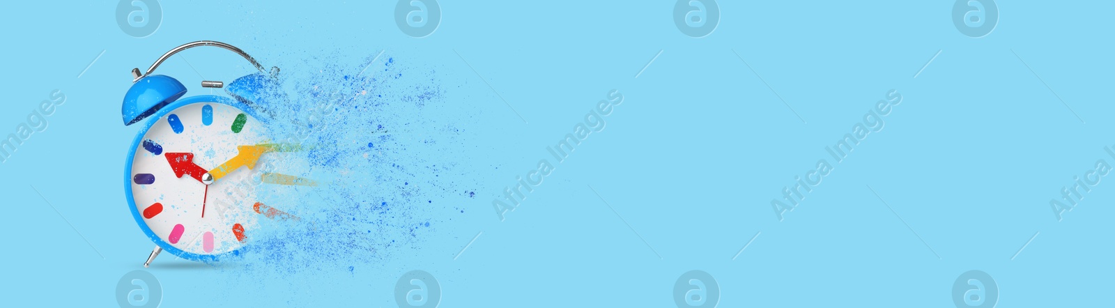 Image of Bright alarm clock dissolving on light blue background, banner design with space for text. Flow of time