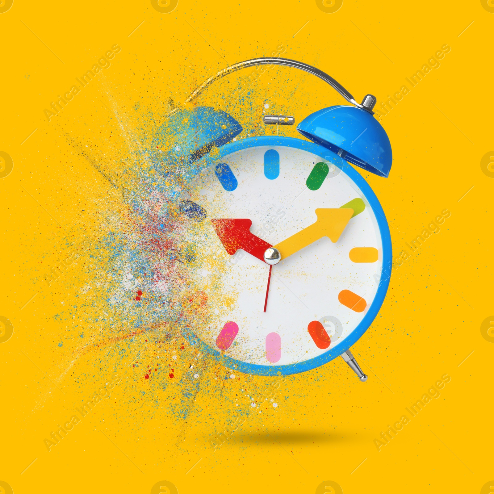 Image of Bright alarm clock dissolving on orange background. Flow of time