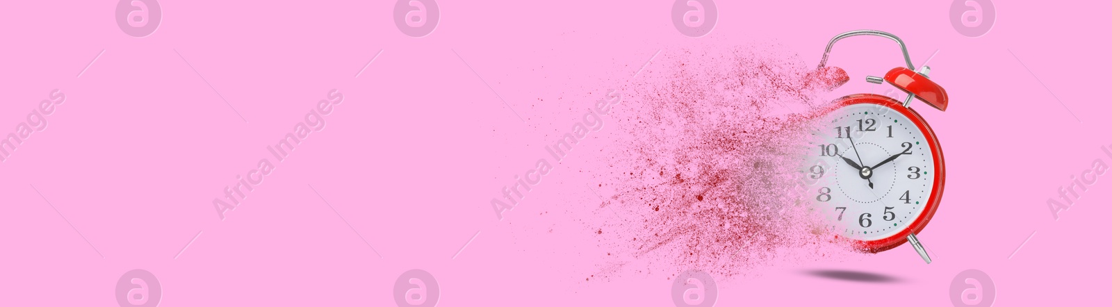 Image of Red alarm clock dissolving on pink background, banner design with space for text. Flow of time