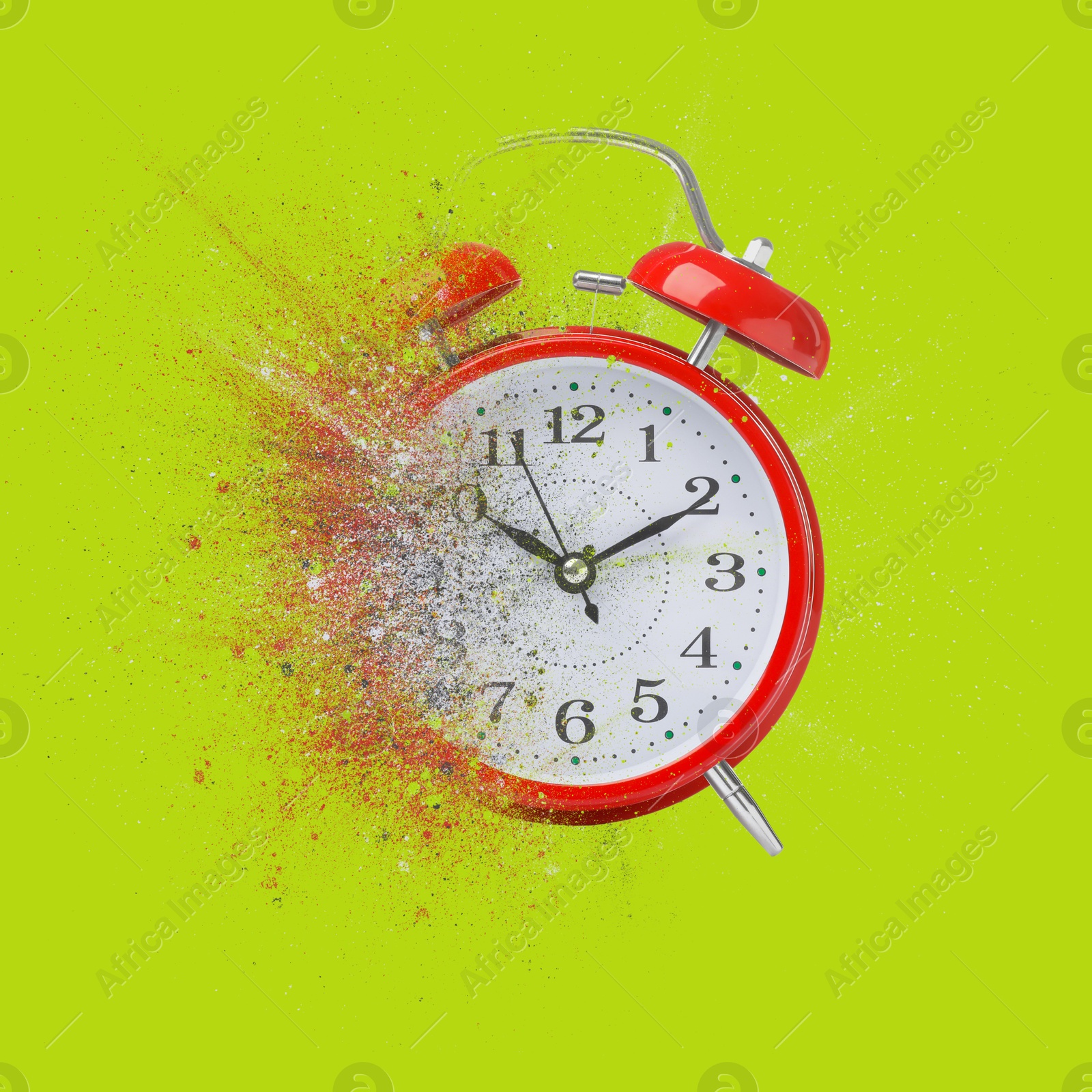 Image of Red alarm clock dissolving on green background. Flow of time