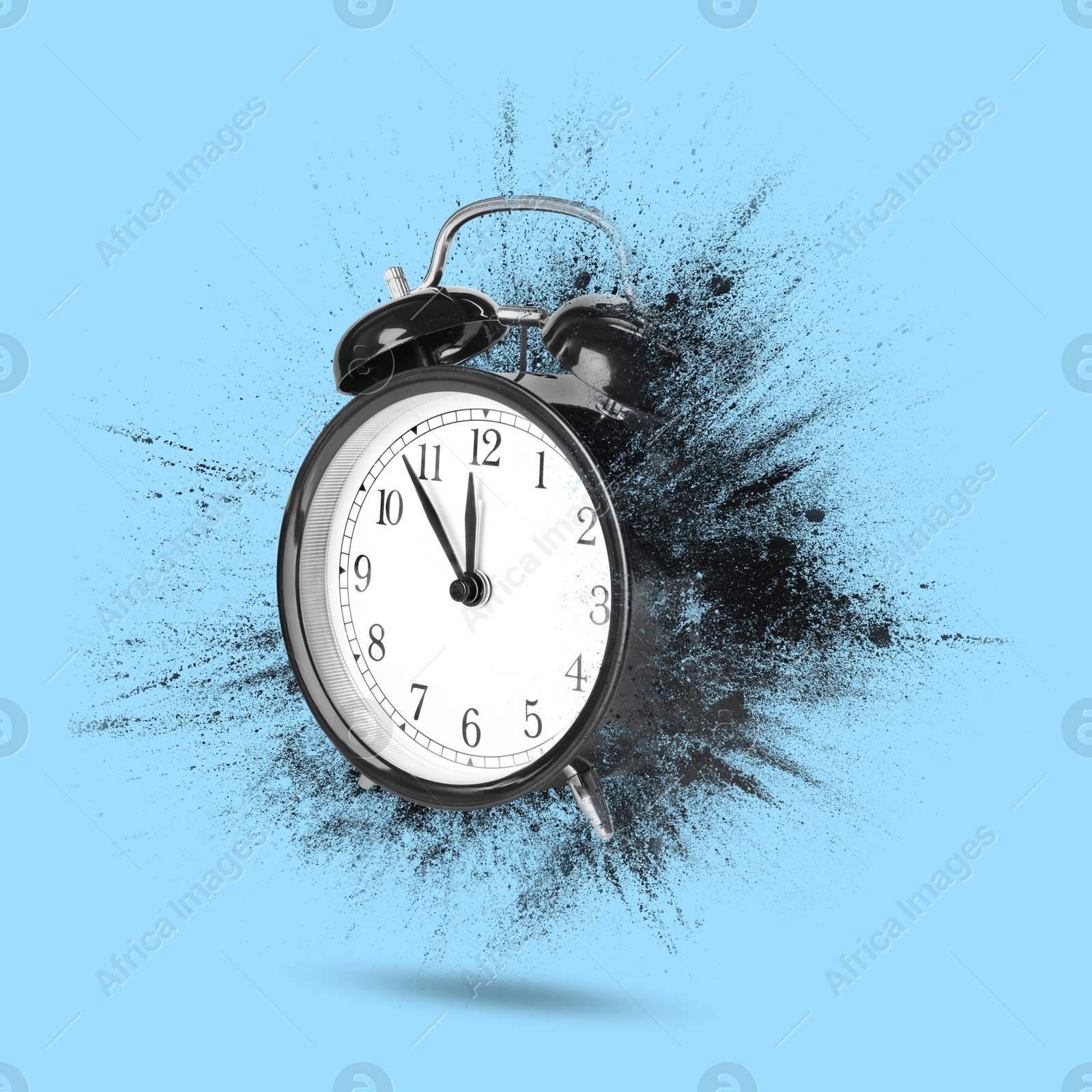 Image of Black alarm clock dissolving on light blue background. Flow of time