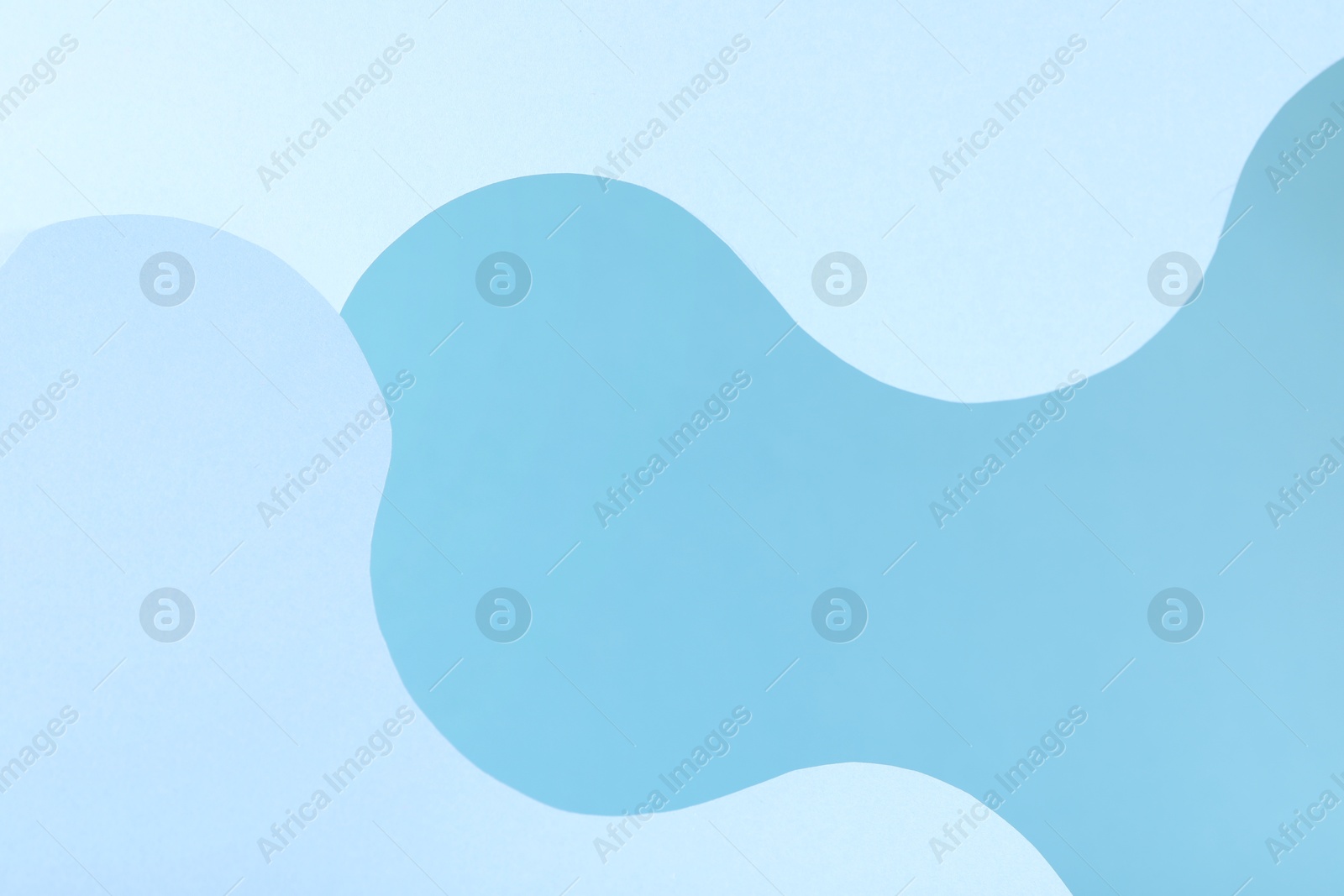 Photo of Presentation of product. Paper cutouts on light blue background. Space for text