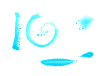 Photo of Different symbols made with light blue spray paint isolated on white, top view