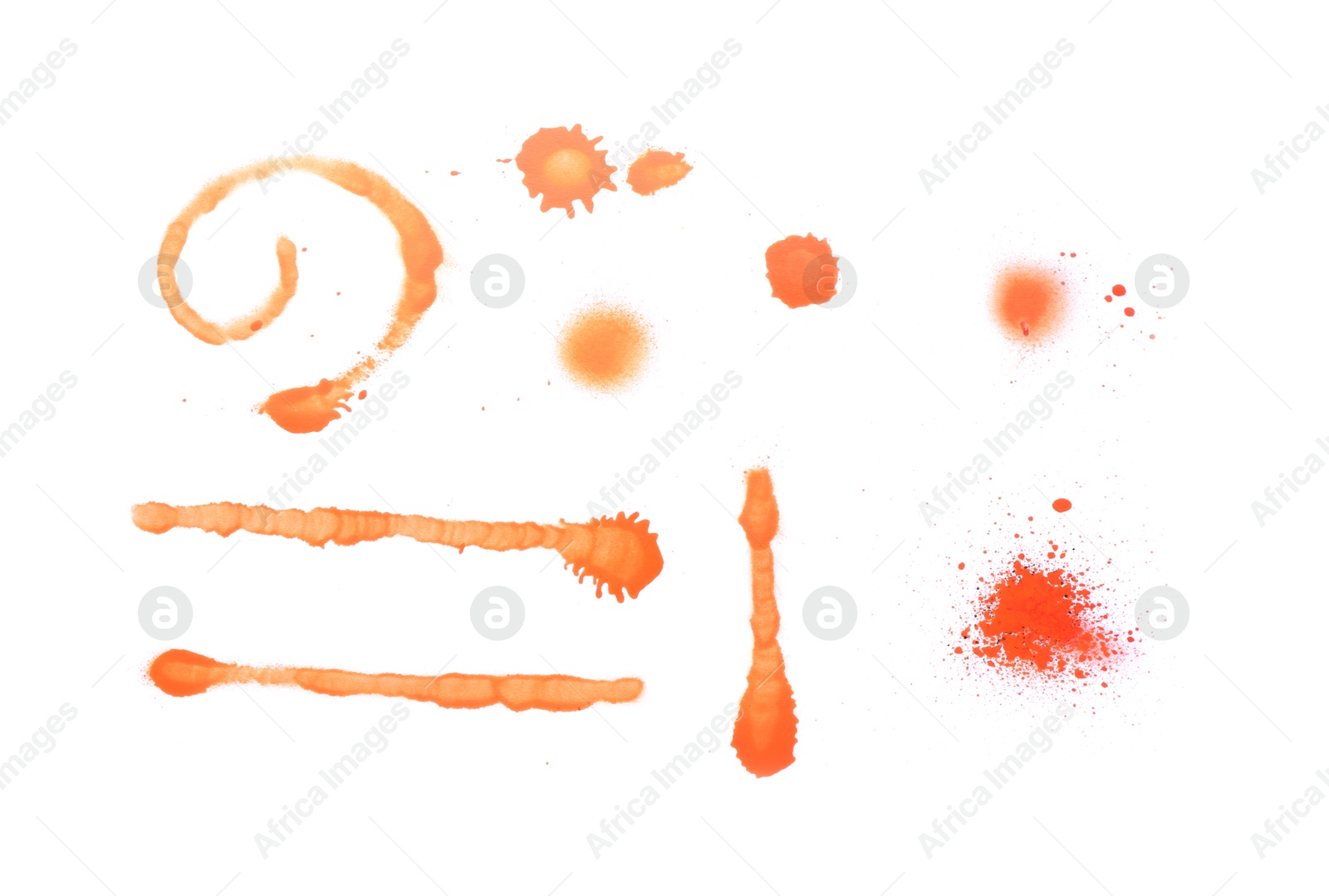 Photo of Different symbols made with orange spray paint isolated on white, top view