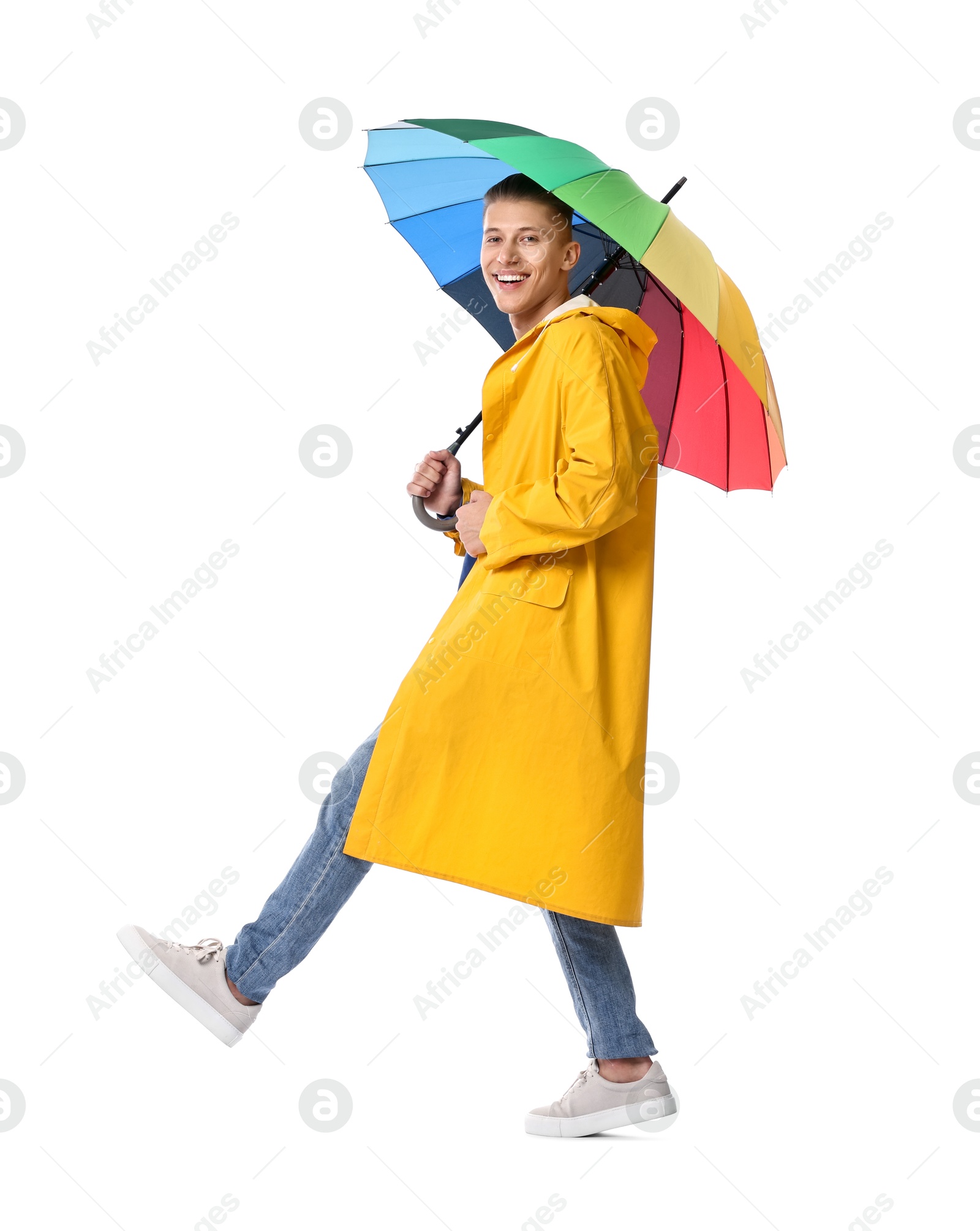 Photo of Young man with rainbow umbrella on white background