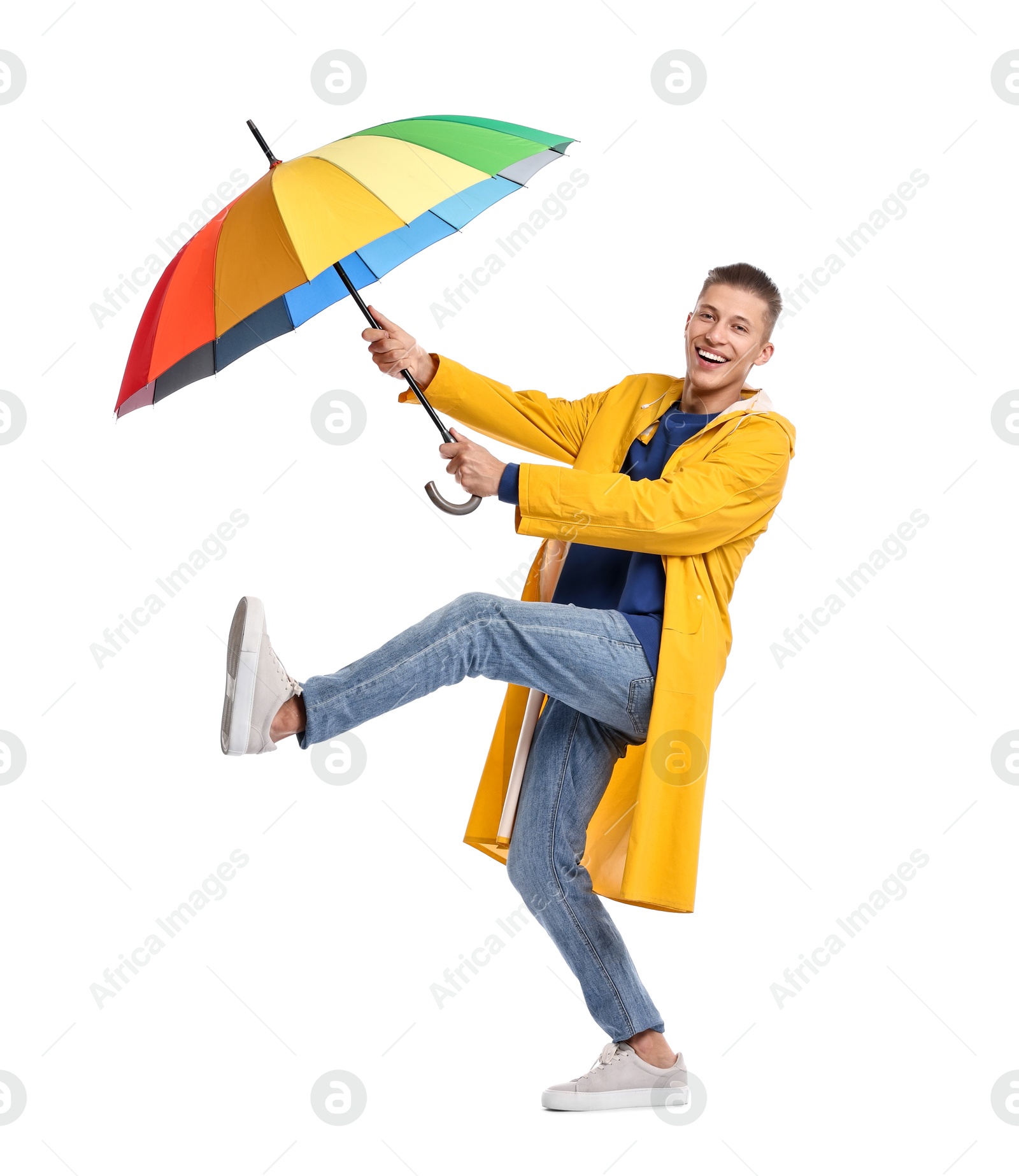 Photo of Young man with rainbow umbrella on white background