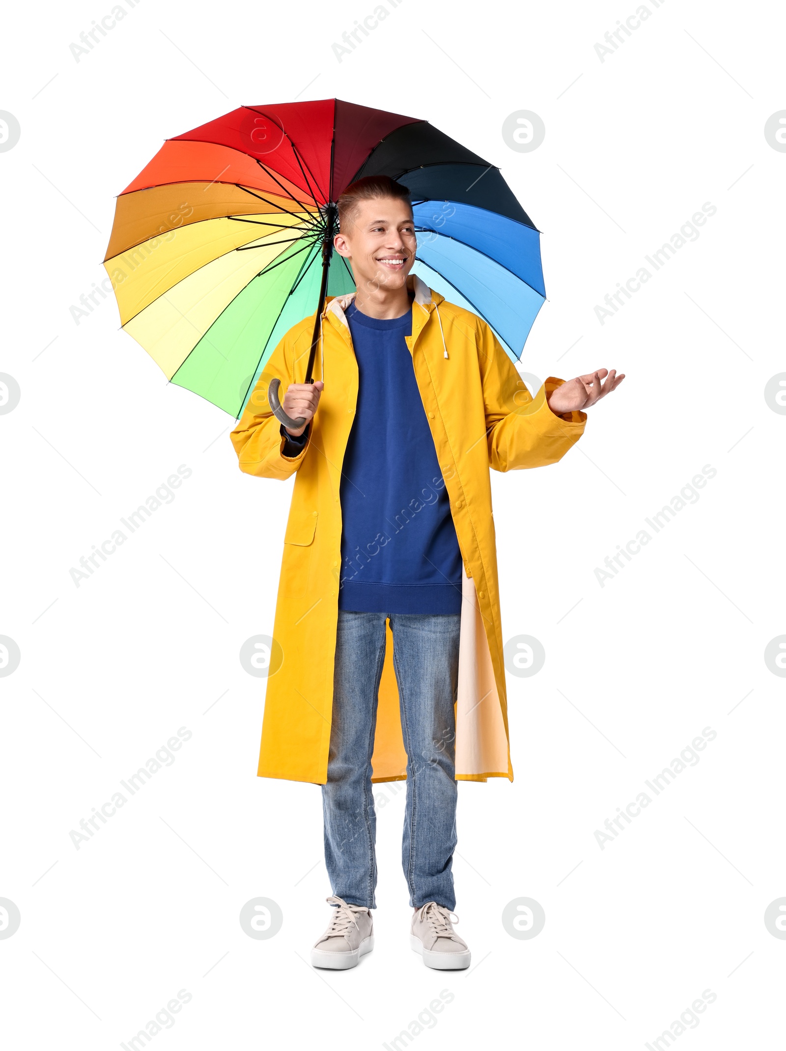 Photo of Young man with rainbow umbrella on white background