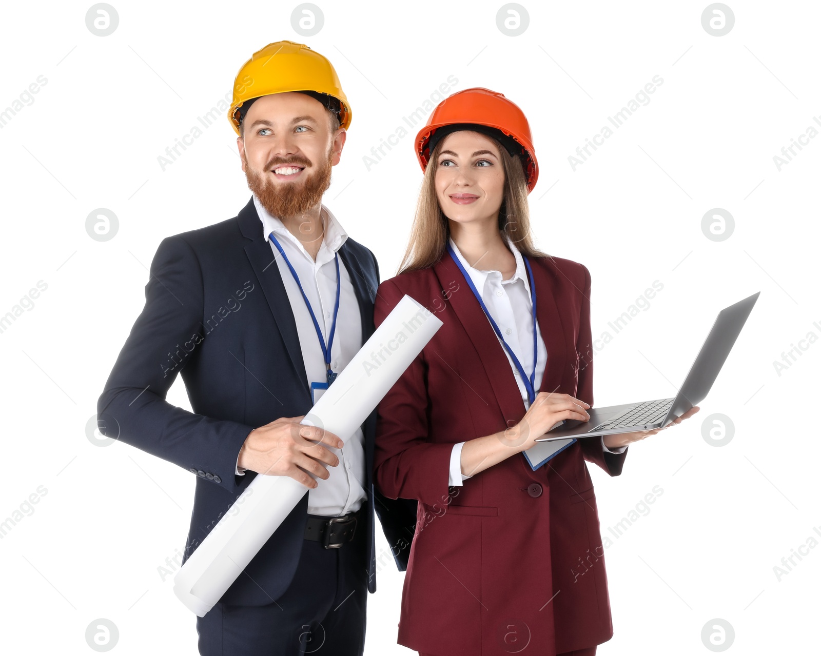 Photo of Engineers in hard hats with laptop and draft on white background