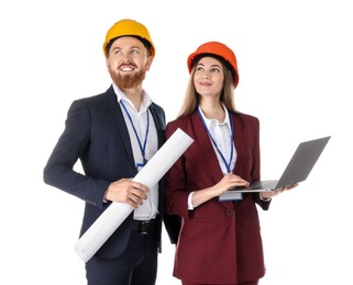 Photo of Engineers in hard hats with laptop and draft on white background