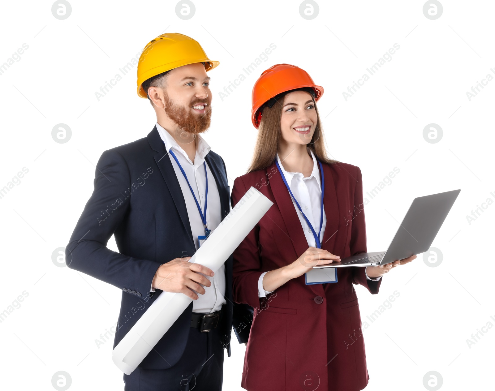 Photo of Engineers in hard hats with laptop and draft on white background