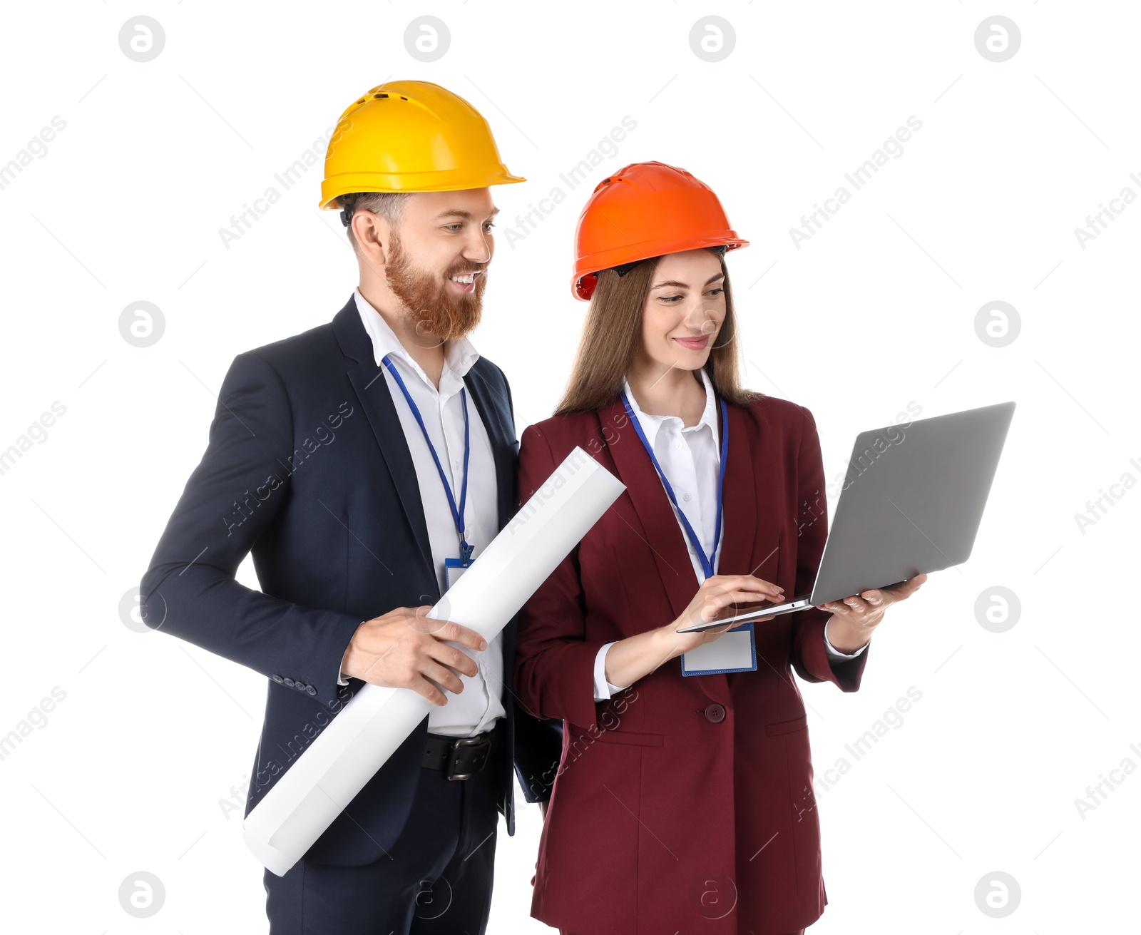 Photo of Engineers in hard hats with laptop and draft on white background