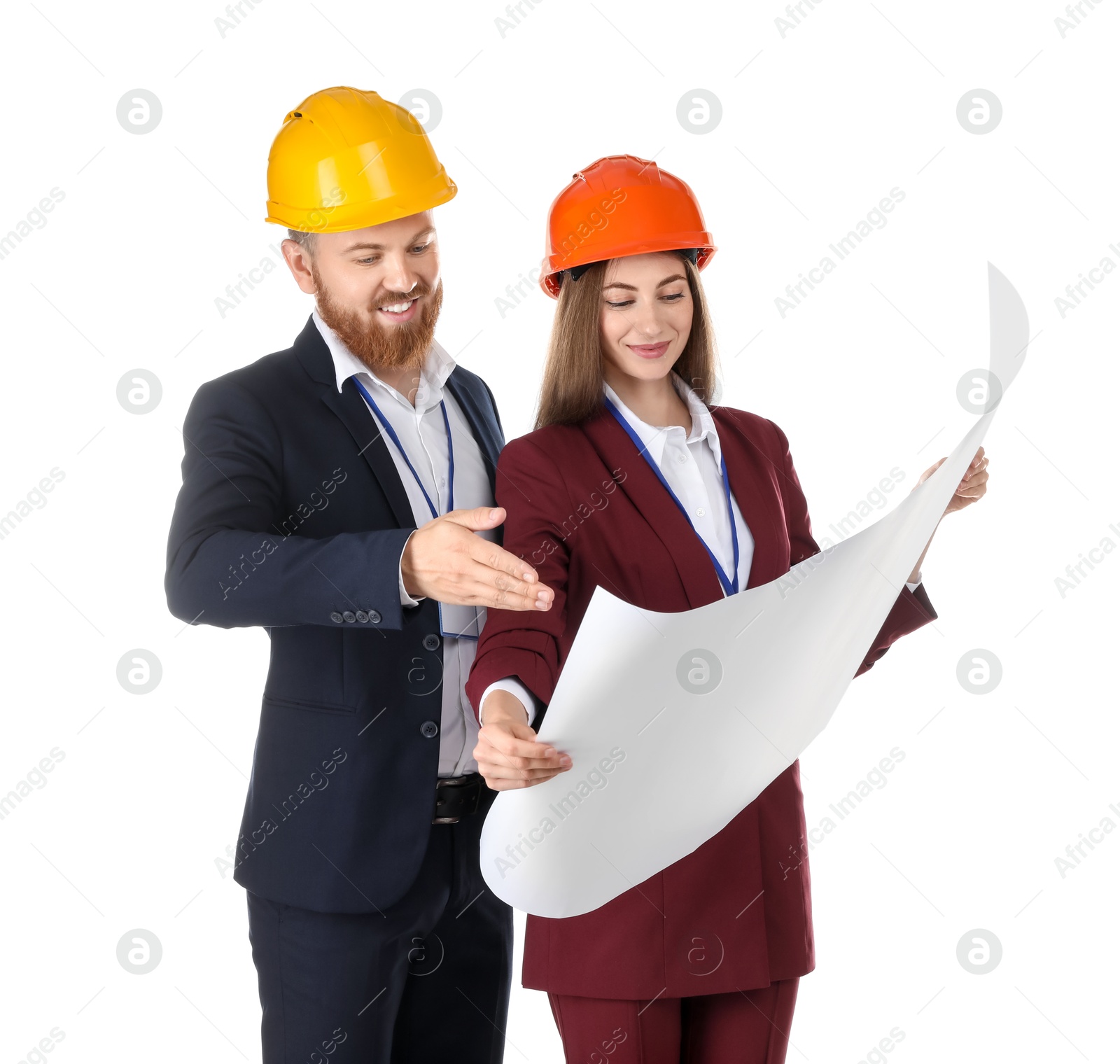 Photo of Engineers in hard hats with draft on white background