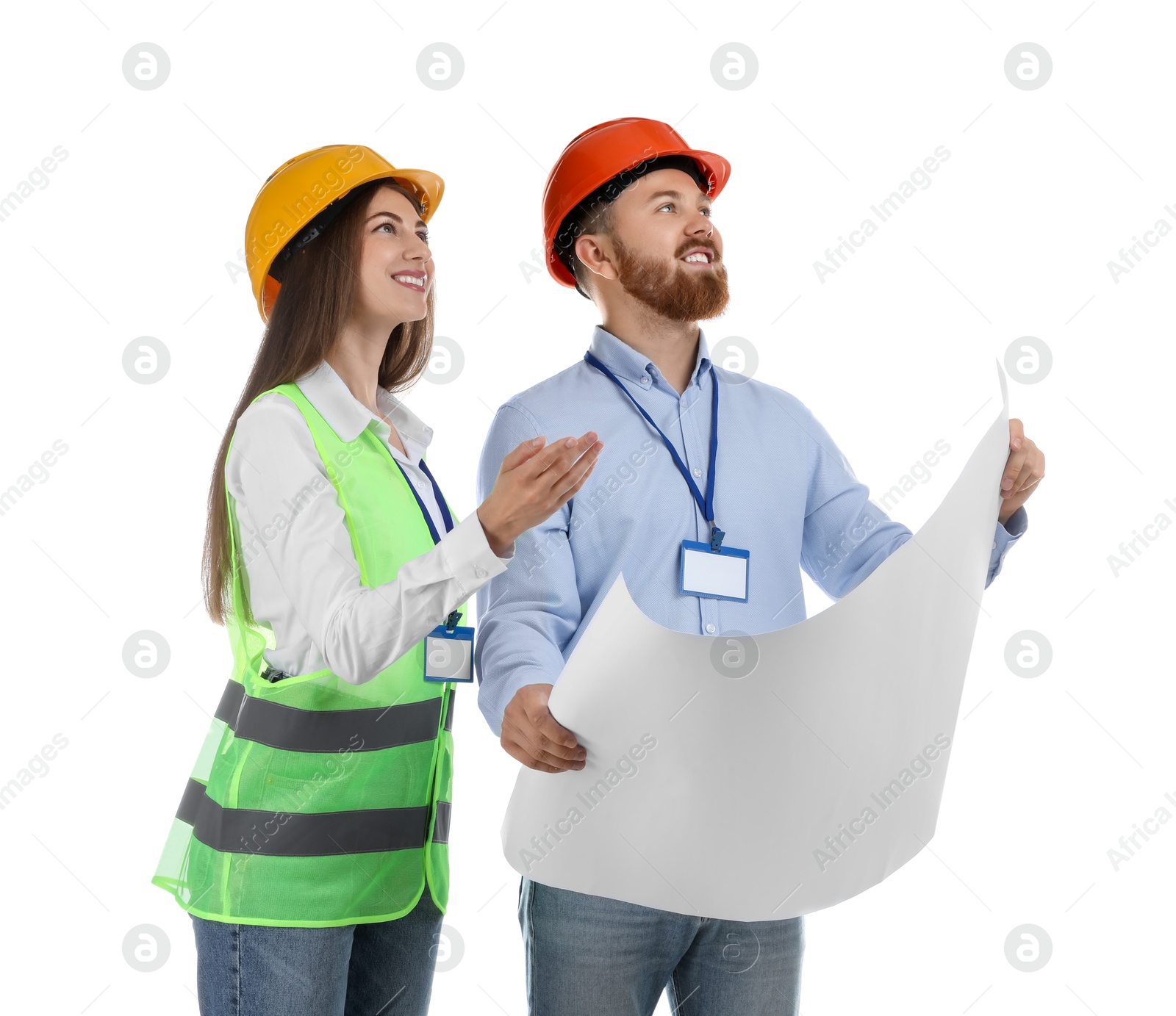 Photo of Engineers in hard hats with draft on white background