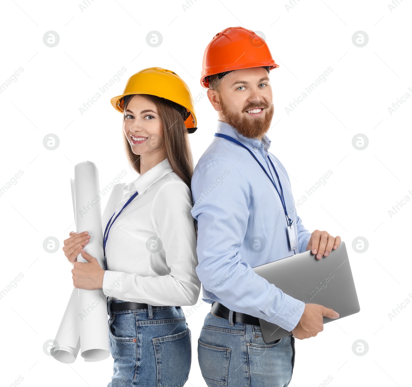 Photo of Engineers in hard hats with laptop and drafts on white background