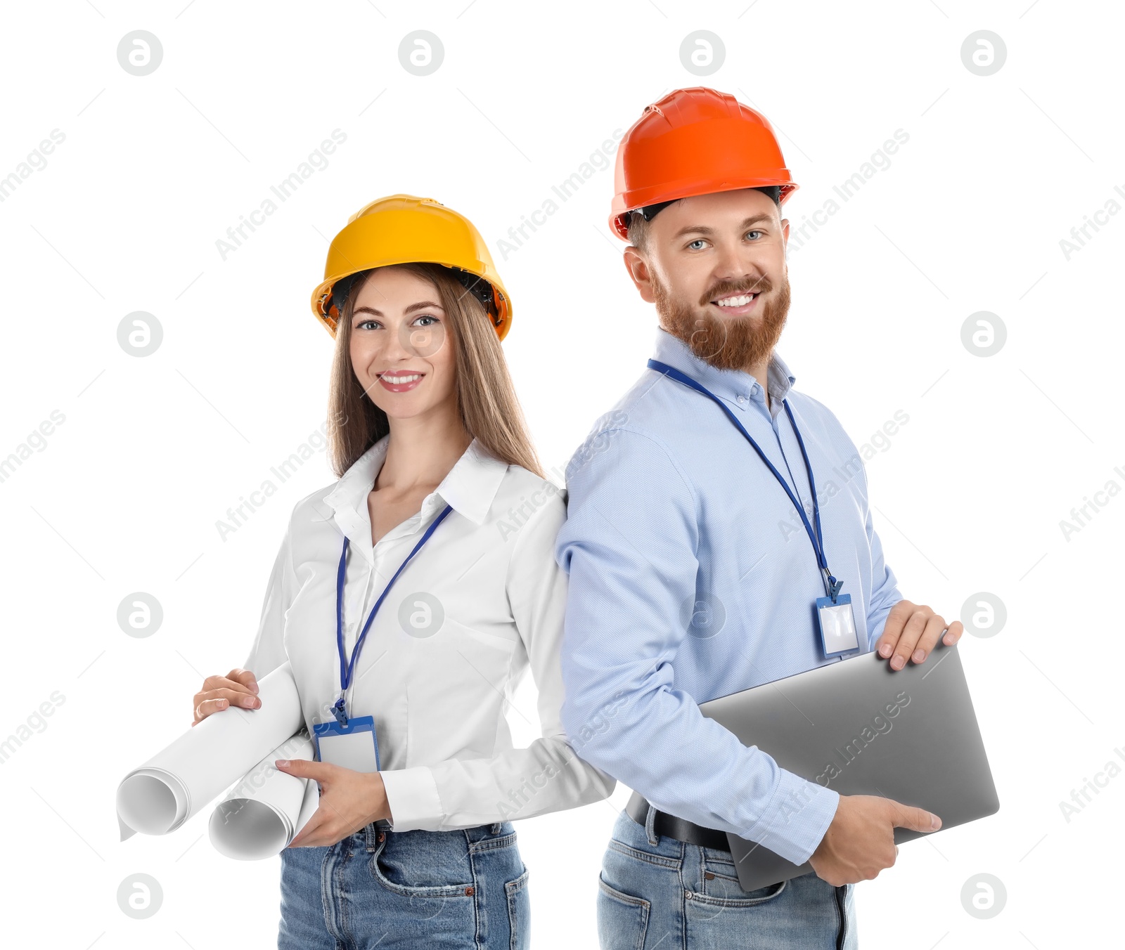 Photo of Engineers in hard hats with laptop and drafts on white background