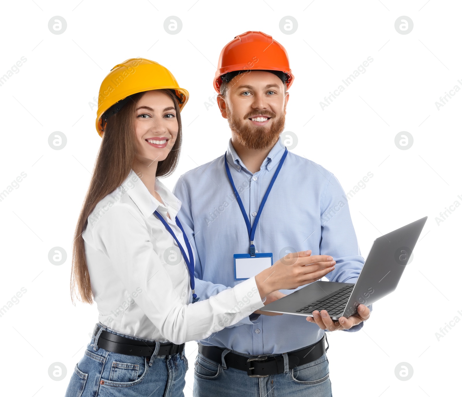 Photo of Engineers in hard hats with laptop on white background