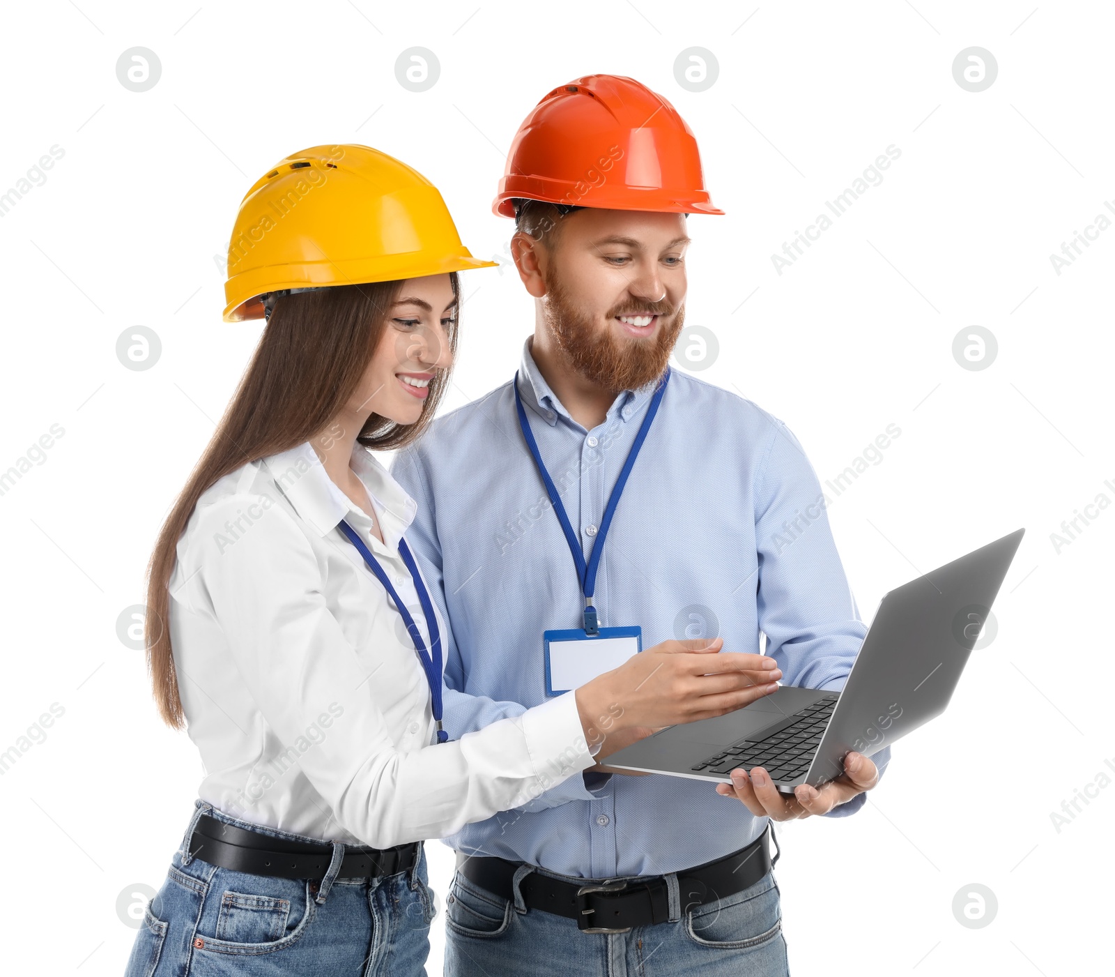 Photo of Engineers in hard hats with laptop on white background