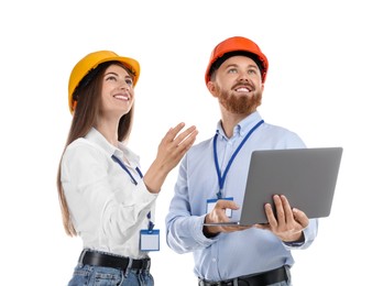 Engineers in hard hats with laptop on white background