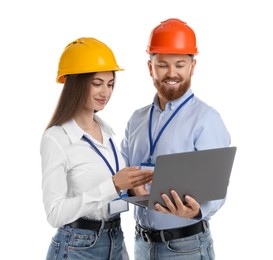 Photo of Engineers in hard hats with laptop on white background