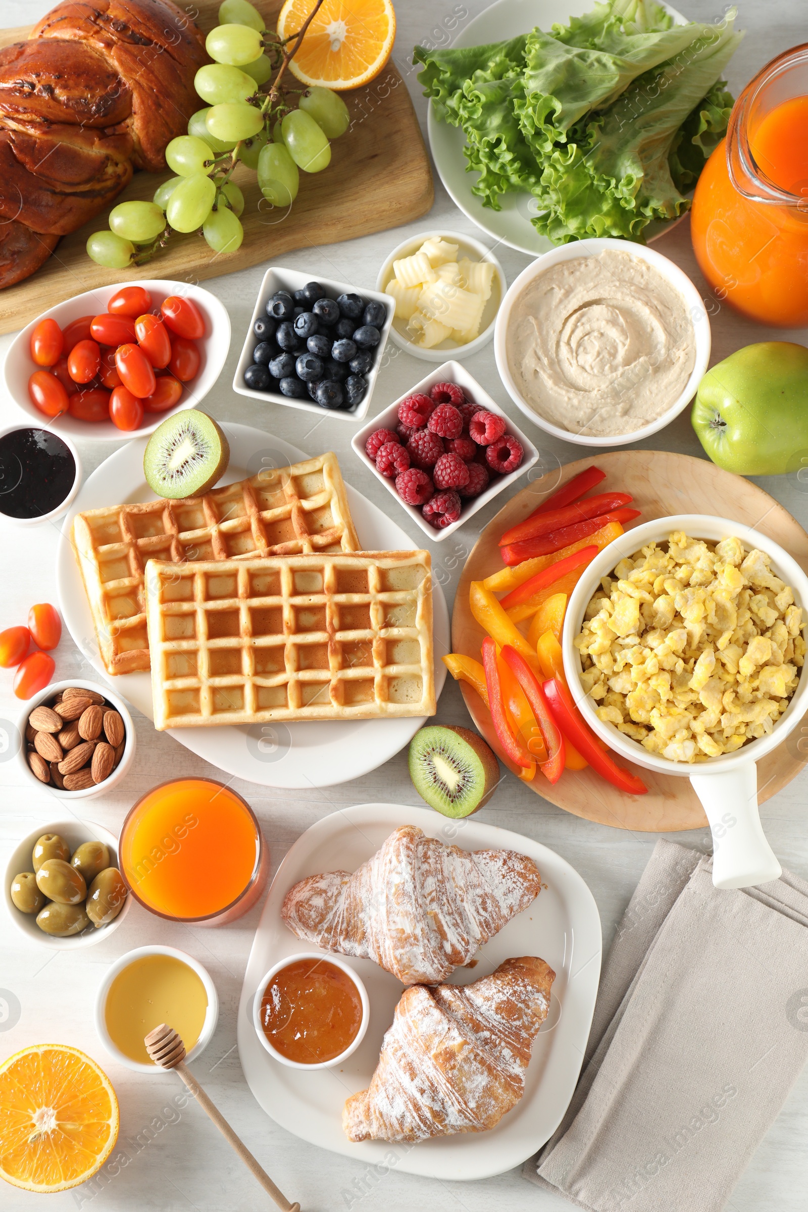 Photo of Tasty breakfast. Flat lay composition with many different food on light table