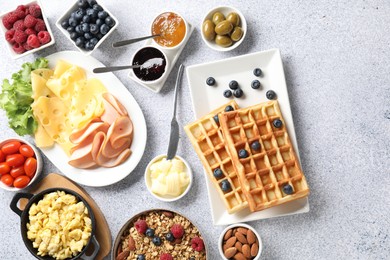 Tasty breakfast. Flat lay composition with many different food on grey textured table