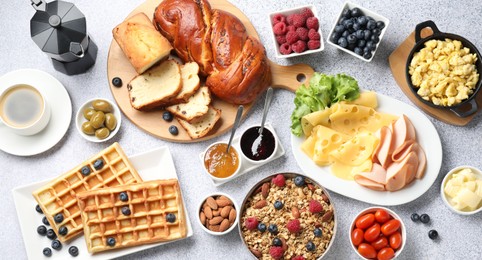 Tasty breakfast. Flat lay composition with many different food and coffee on grey textured table