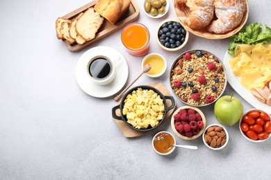 Photo of Tasty breakfast. Flat lay composition with many different food and drinks on grey textured table. Space for text