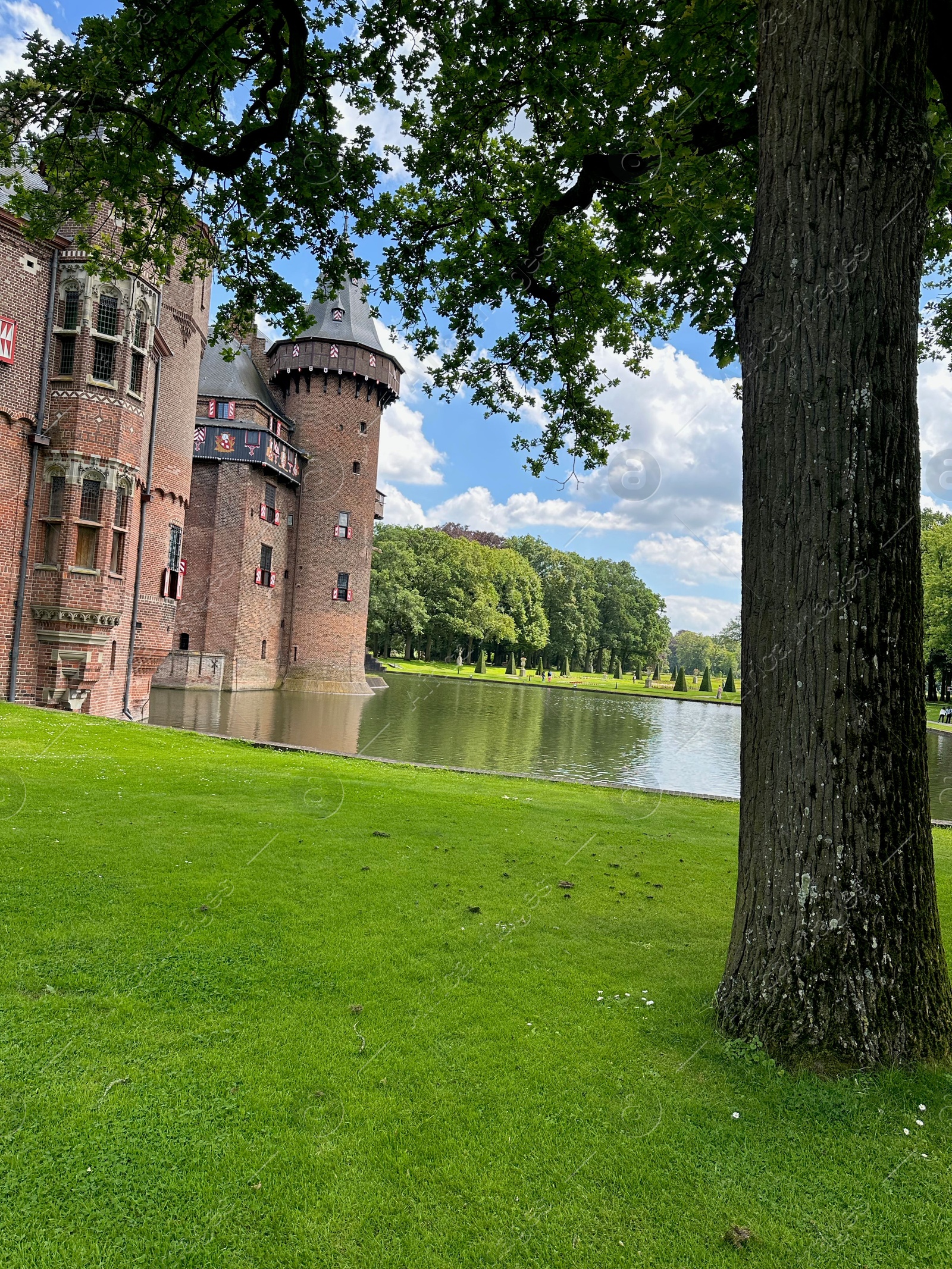 Photo of Utrecht, Netherlands - June 17, 2024: Beautiful De Haar castle, lake and tree outdoors