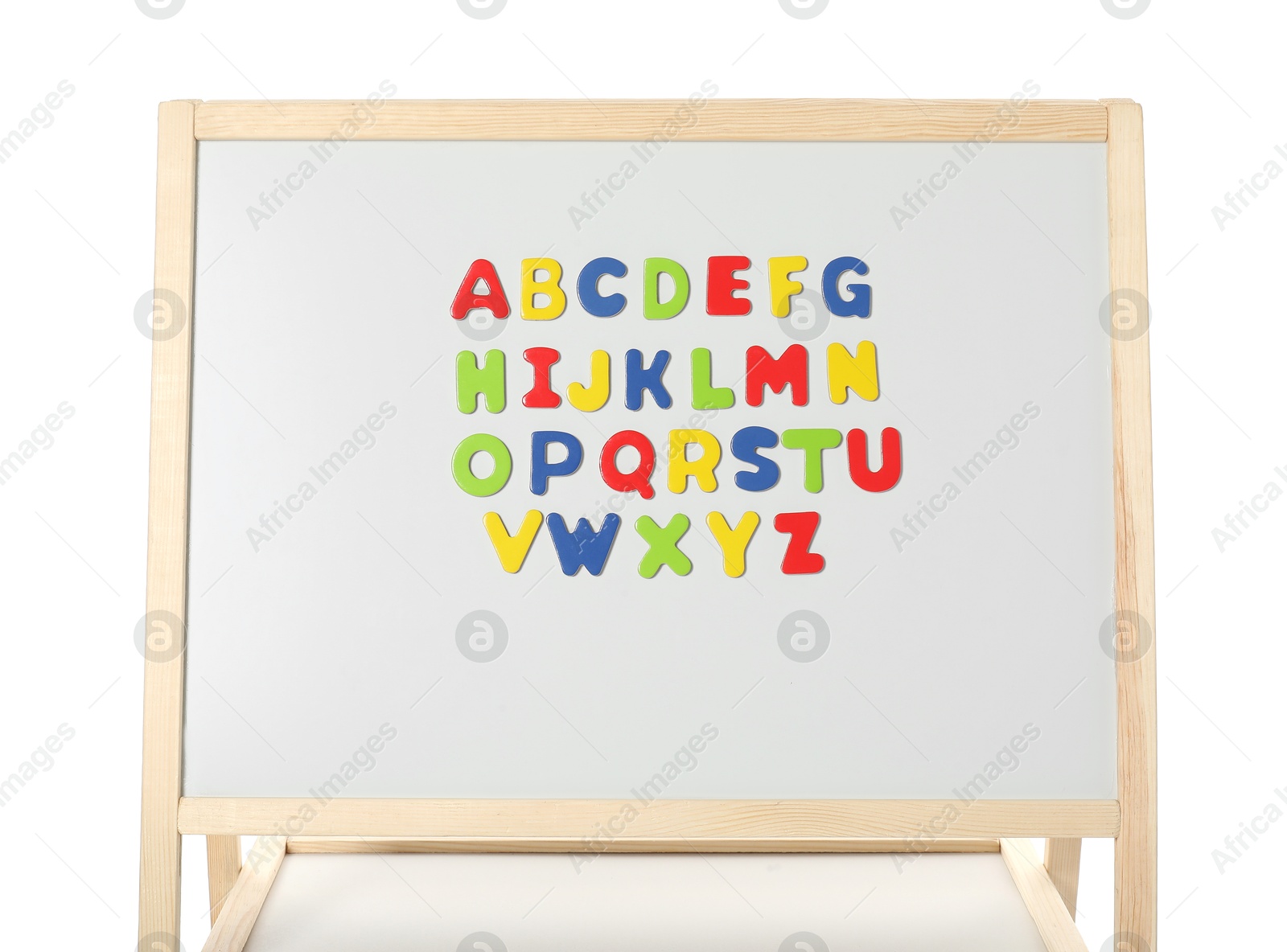 Photo of Alphabetical order. Magnetic letters on board against white background