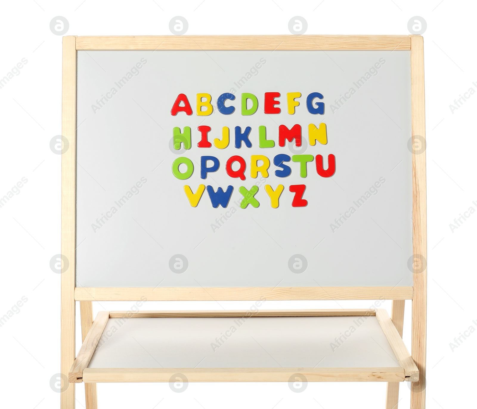 Photo of Alphabetical order. Magnetic letters on board against white background