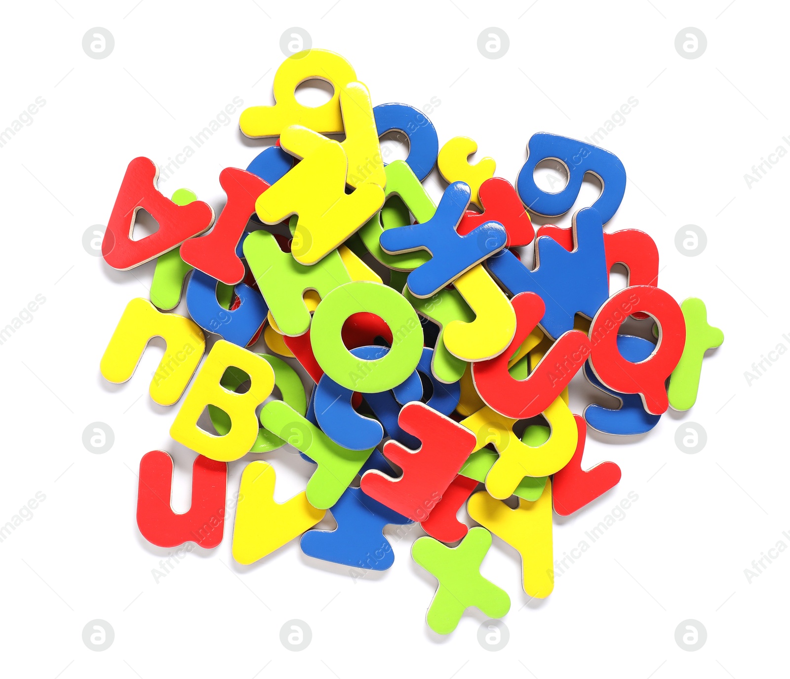 Photo of Learning alphabet. Bright magnetic letters isolated on white, top view