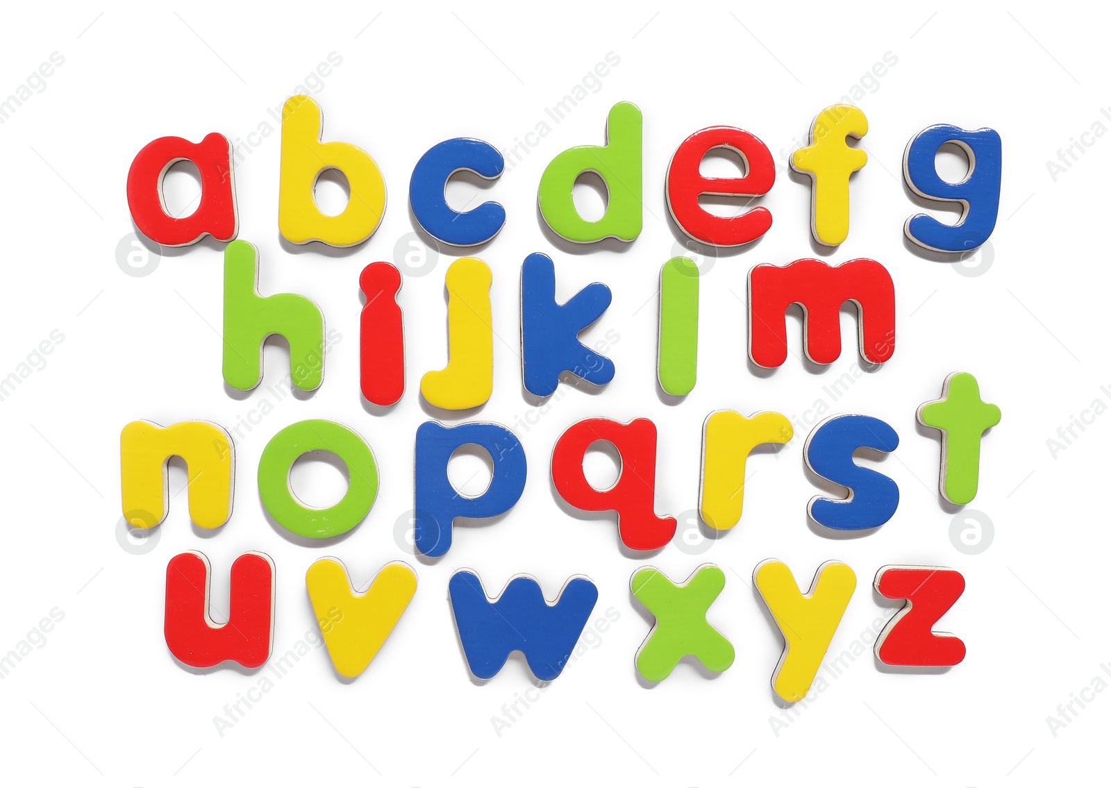 Photo of Alphabetical order. Bright magnetic letters isolated on white