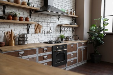 Photo of Beautiful kitchen interior with new stylish furniture