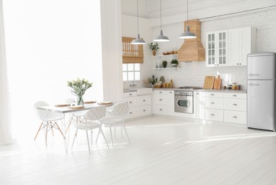 Photo of Beautiful kitchen interior with new stylish furniture