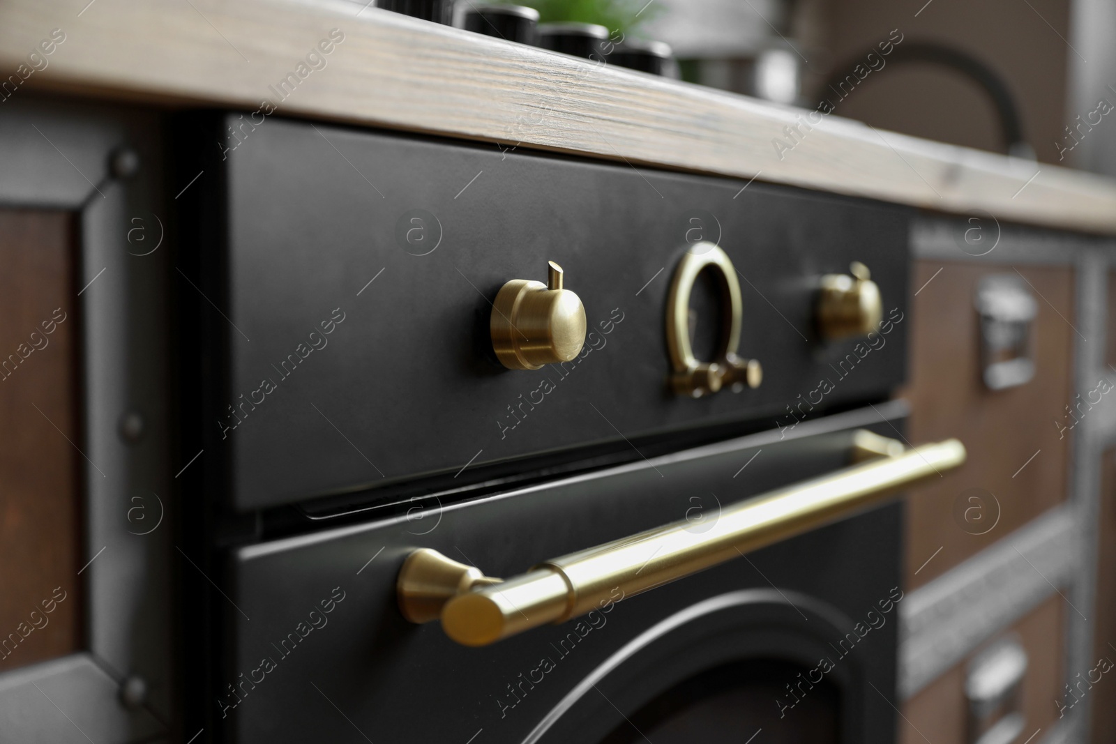 Photo of New modern oven in kitchen, closeup view