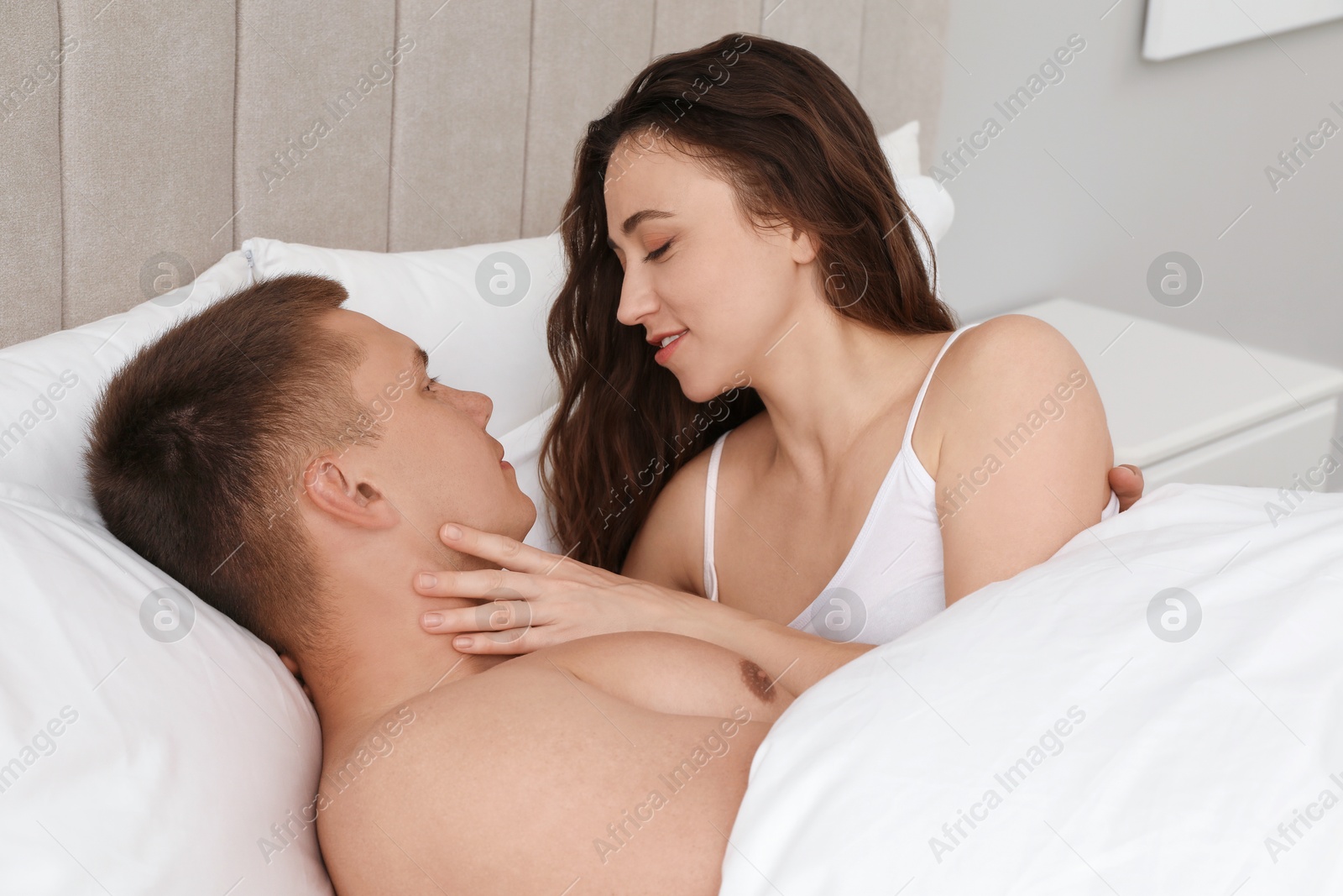 Photo of Lovely couple spending time together in bed