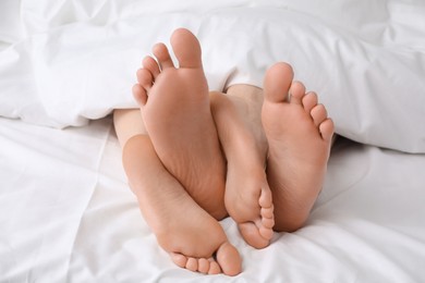 Lovely couple lying in bed, closeup view