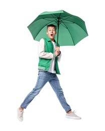 Photo of Young man with green umbrella jumping on white background