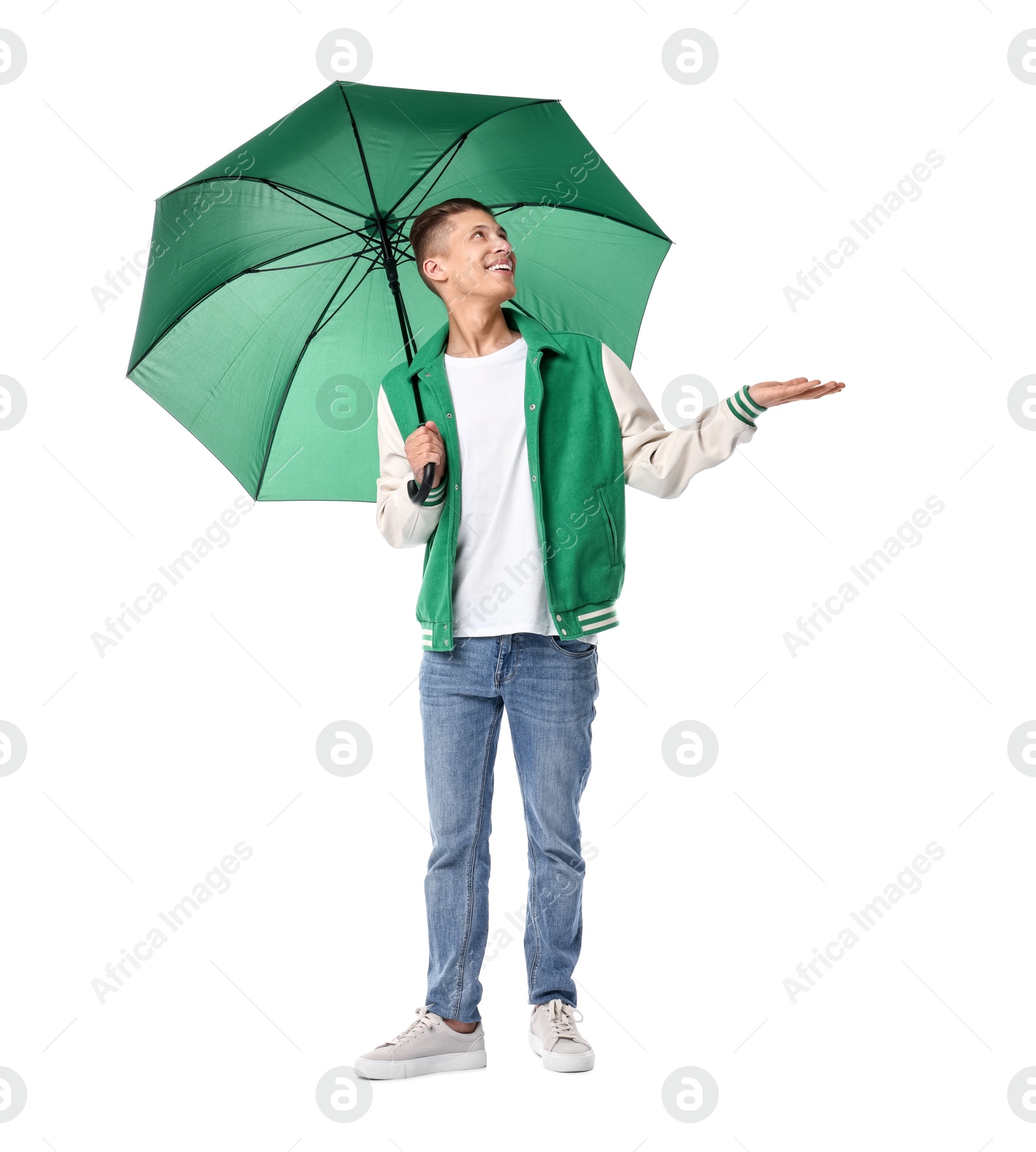 Photo of Young man with green umbrella on white background