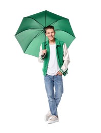 Photo of Young man with green umbrella on white background