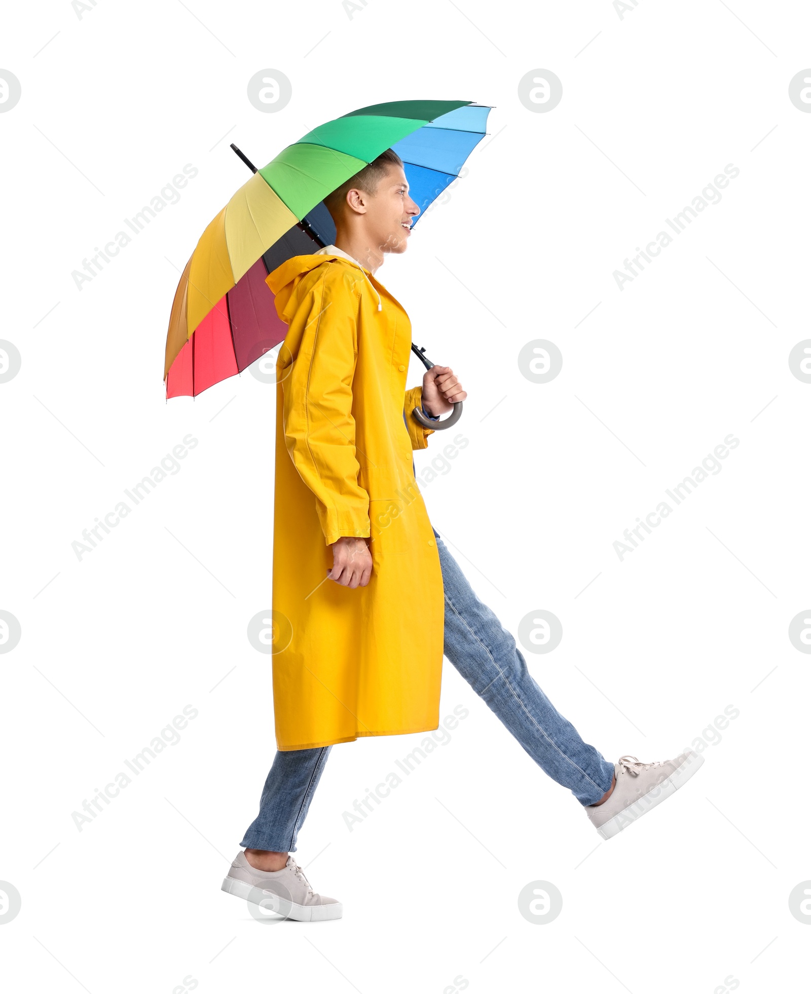 Photo of Young man with rainbow umbrella on white background