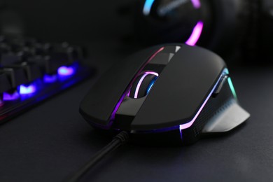 Photo of Computer mouse on black background, closeup view