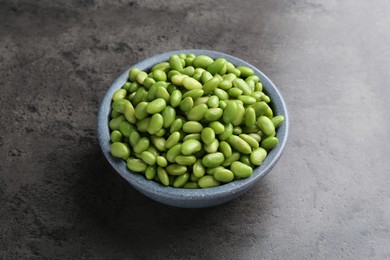 Photo of Raw green edamame soybeans on grey table