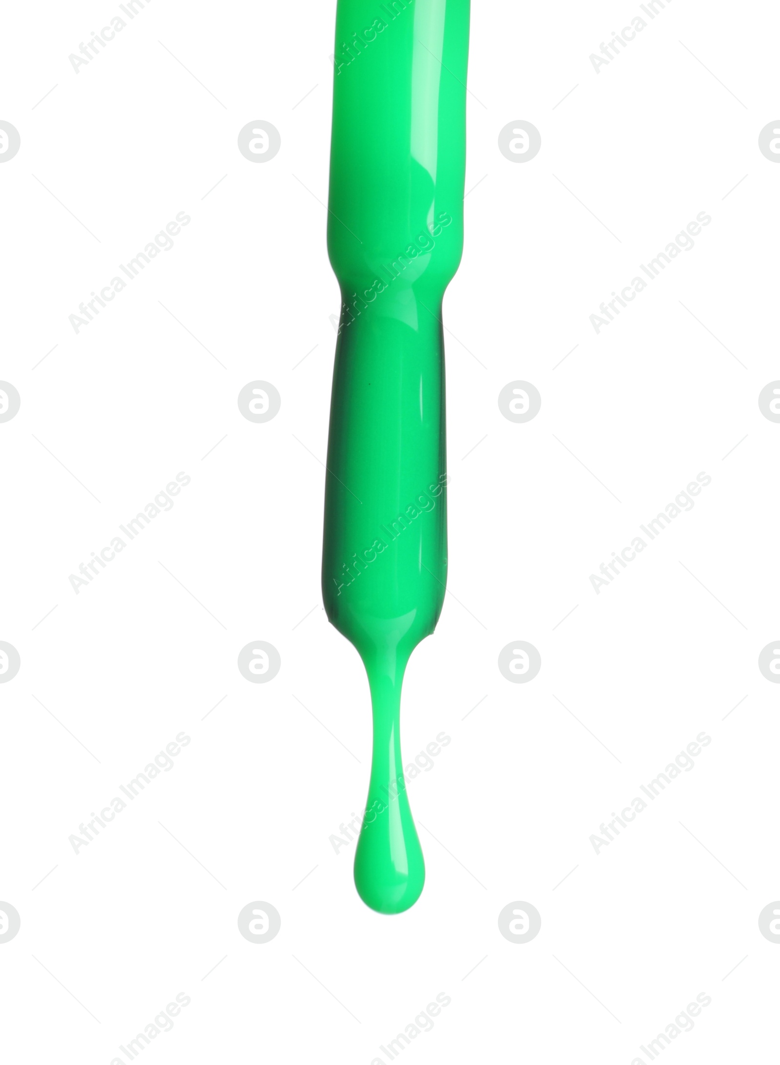 Photo of Green nail polish dripping from brush isolated on white