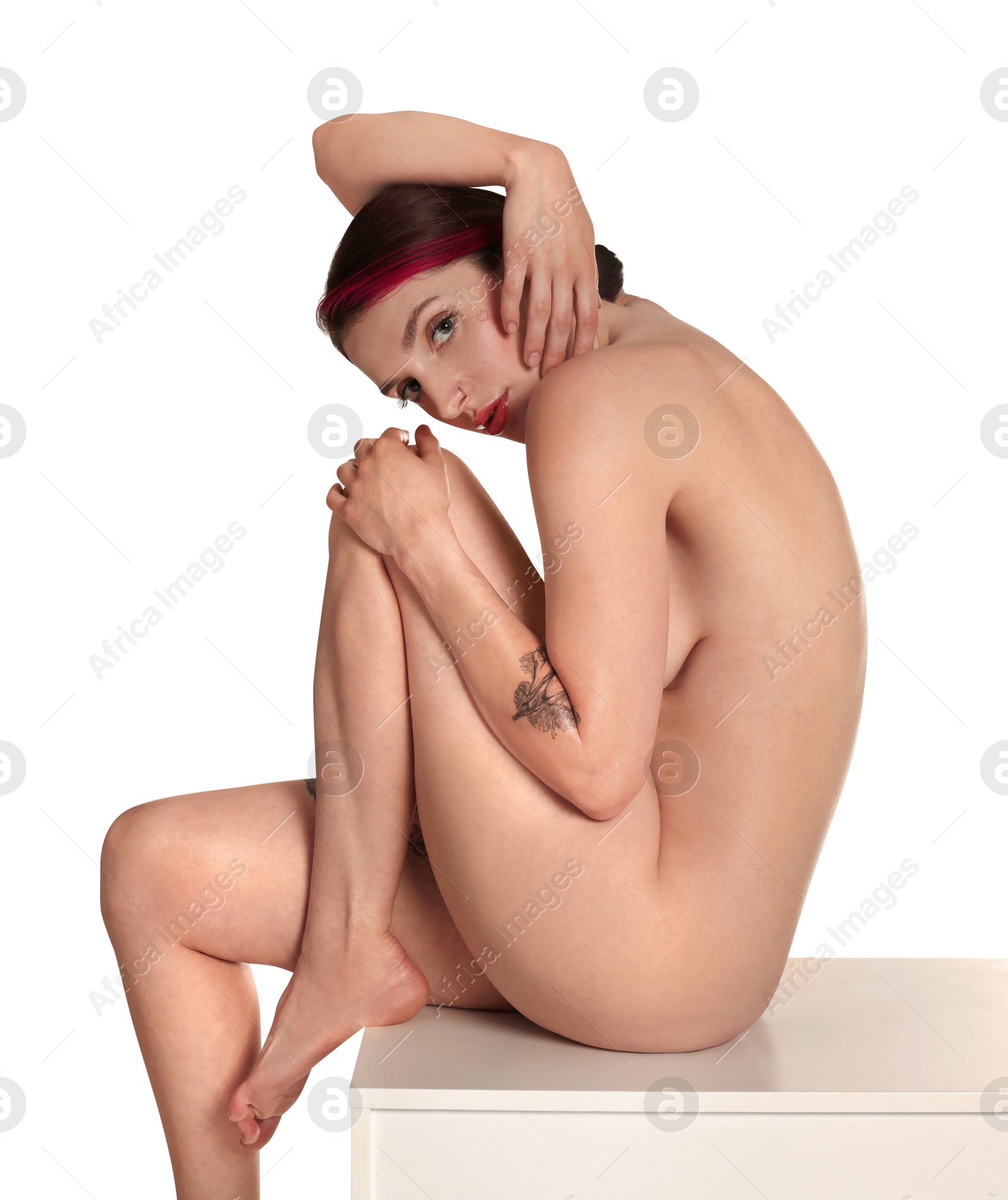 Photo of Beautiful nude woman posing on white background