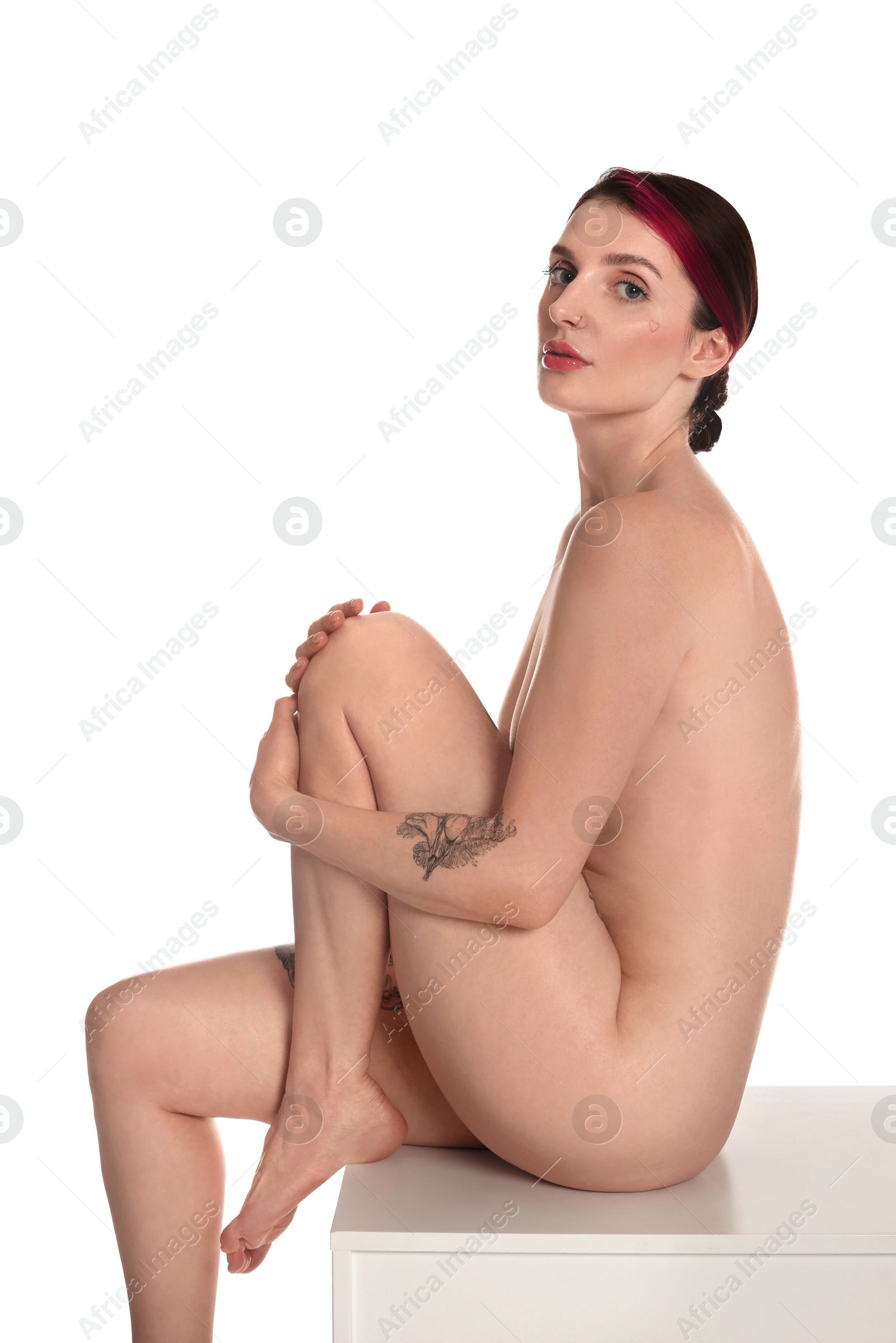 Photo of Beautiful nude woman posing on white background